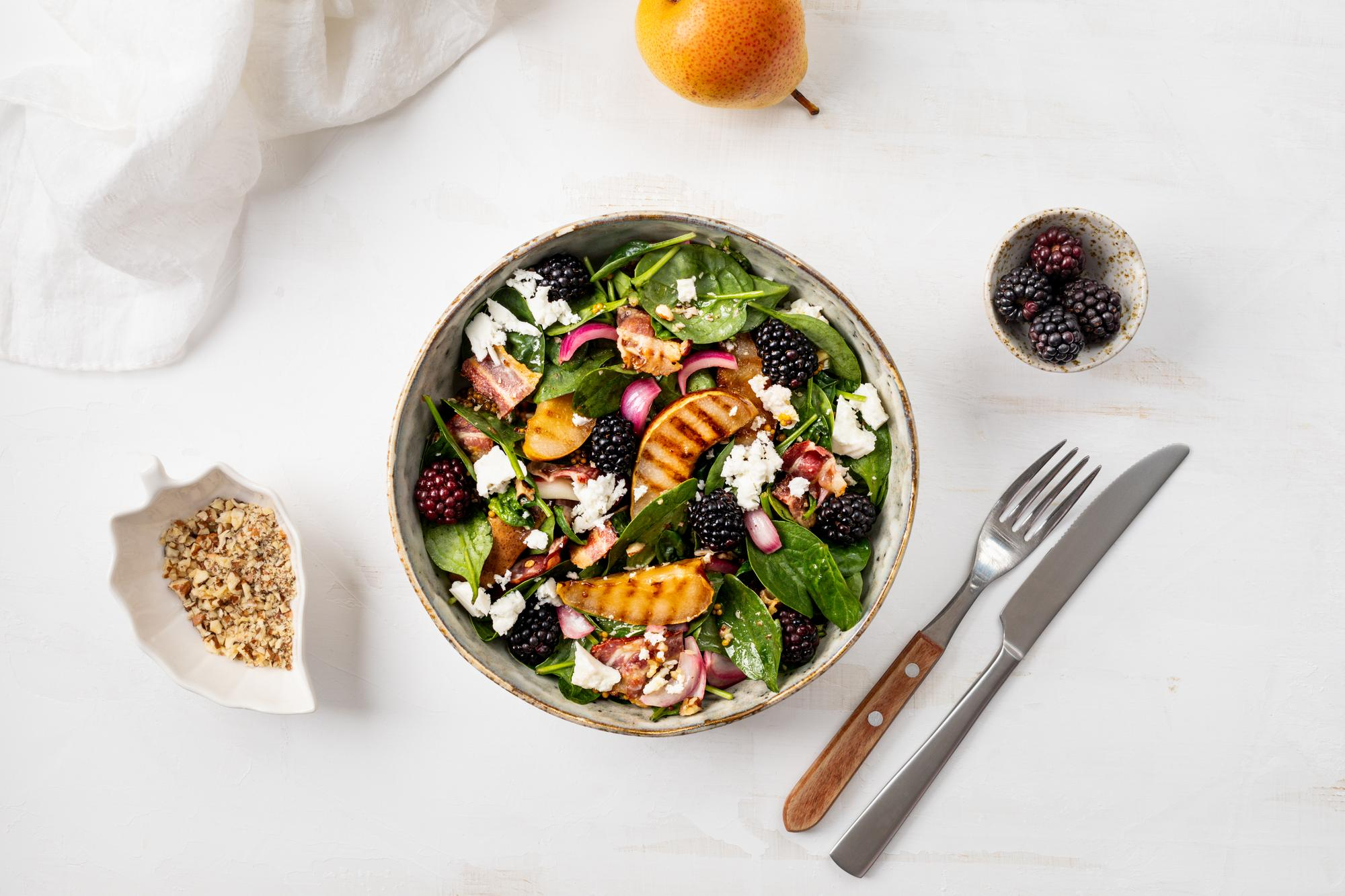 Goodness Served worktop with grains, herbs and seasonal vegetables